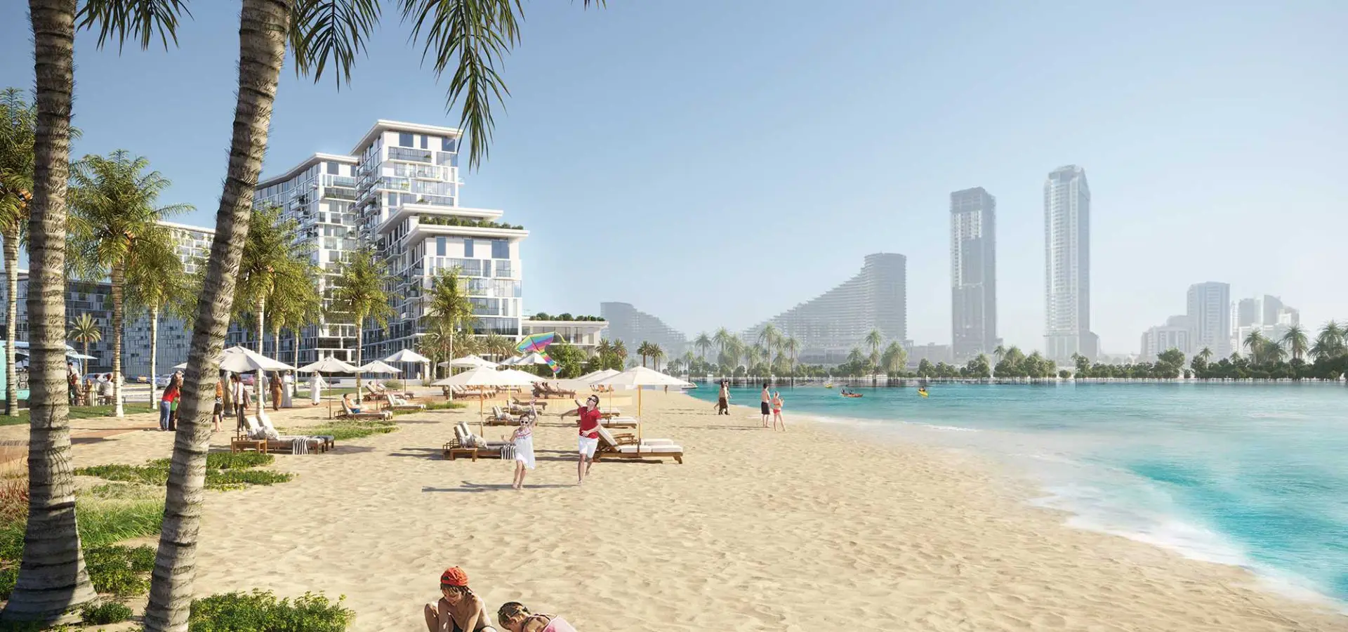 A palm-lined beach with Seefa residences overlooking clear coastal water